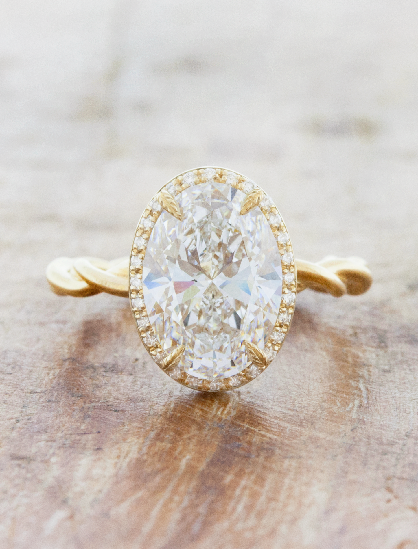 caption:Shown with 2.75ct oval in 14k yellow gold, custom plain twisted band