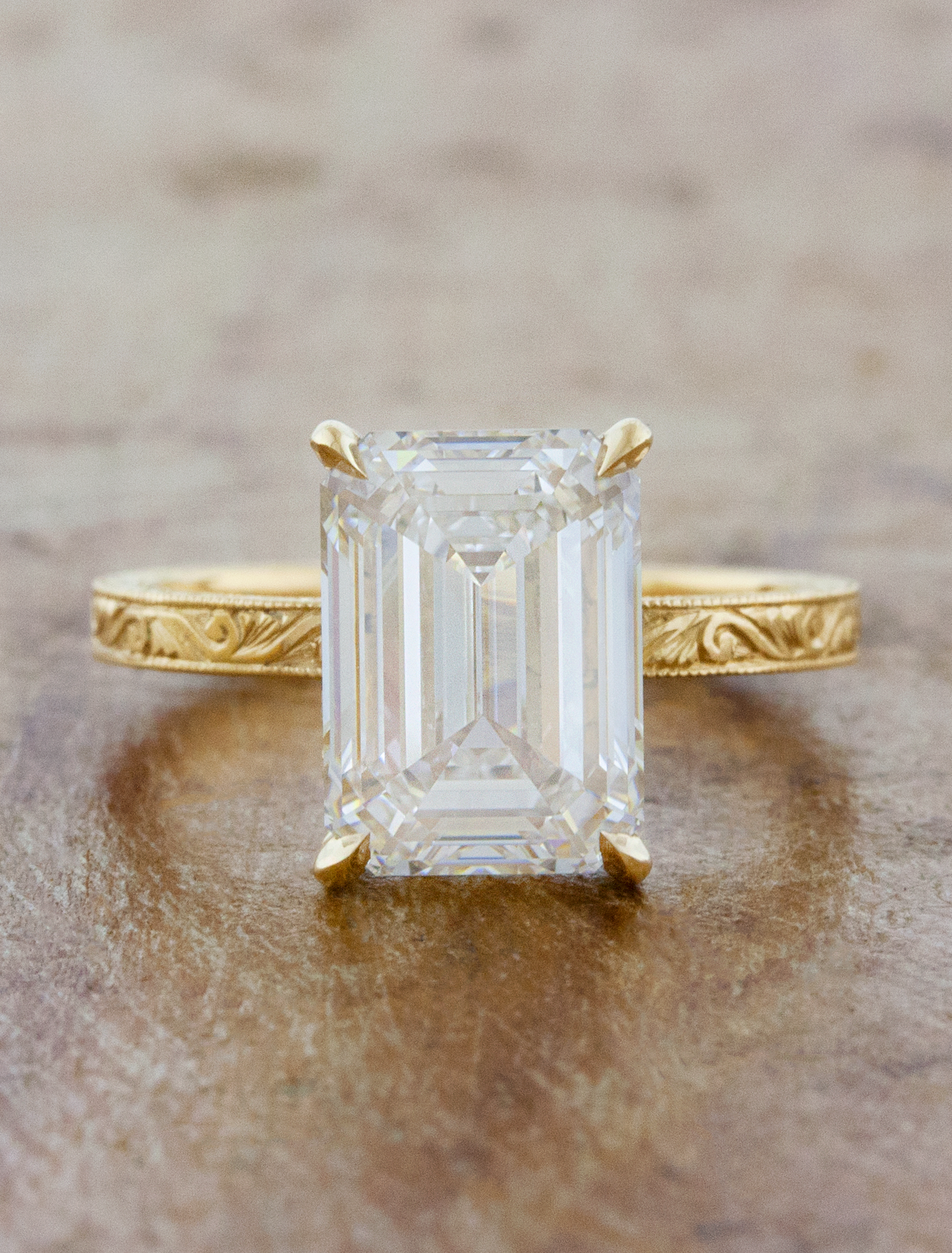 caption:Shown with 4ct emerald cut in 14k yellow gold, custom single prongs