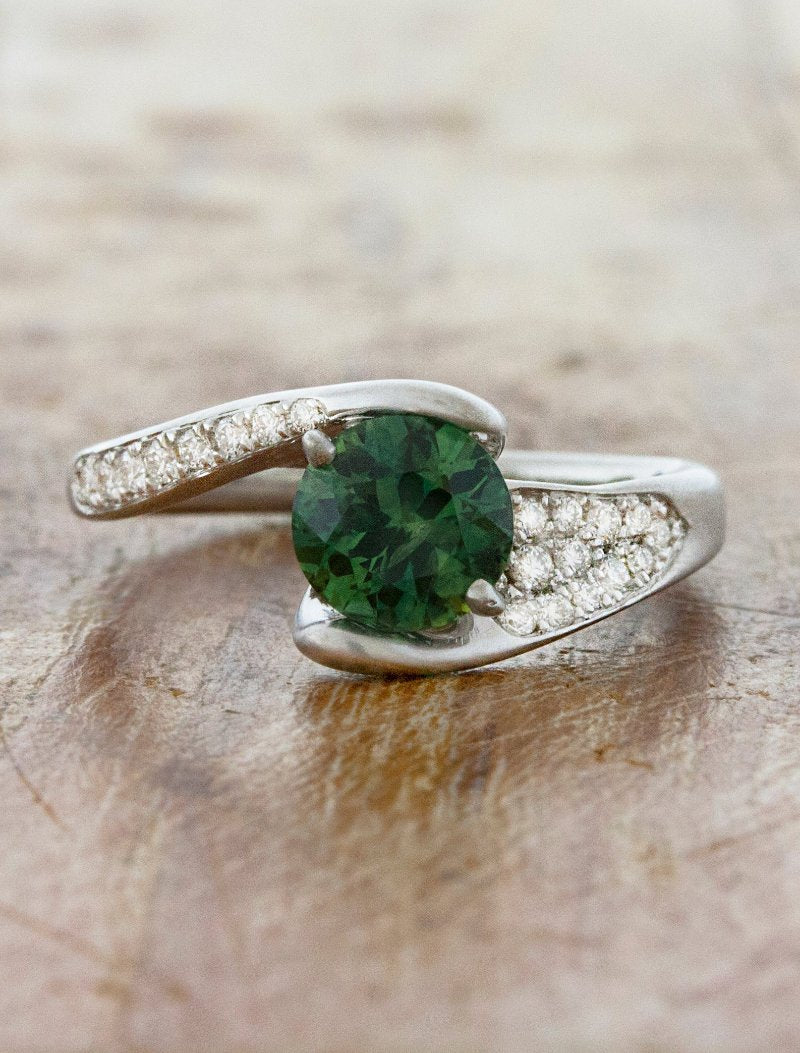 caption:Shown with 1.2ct round Montana Sapphire in platinum