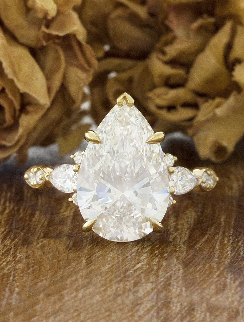 caption:Shown with 5ct pear diamond in 14k yellow gold
