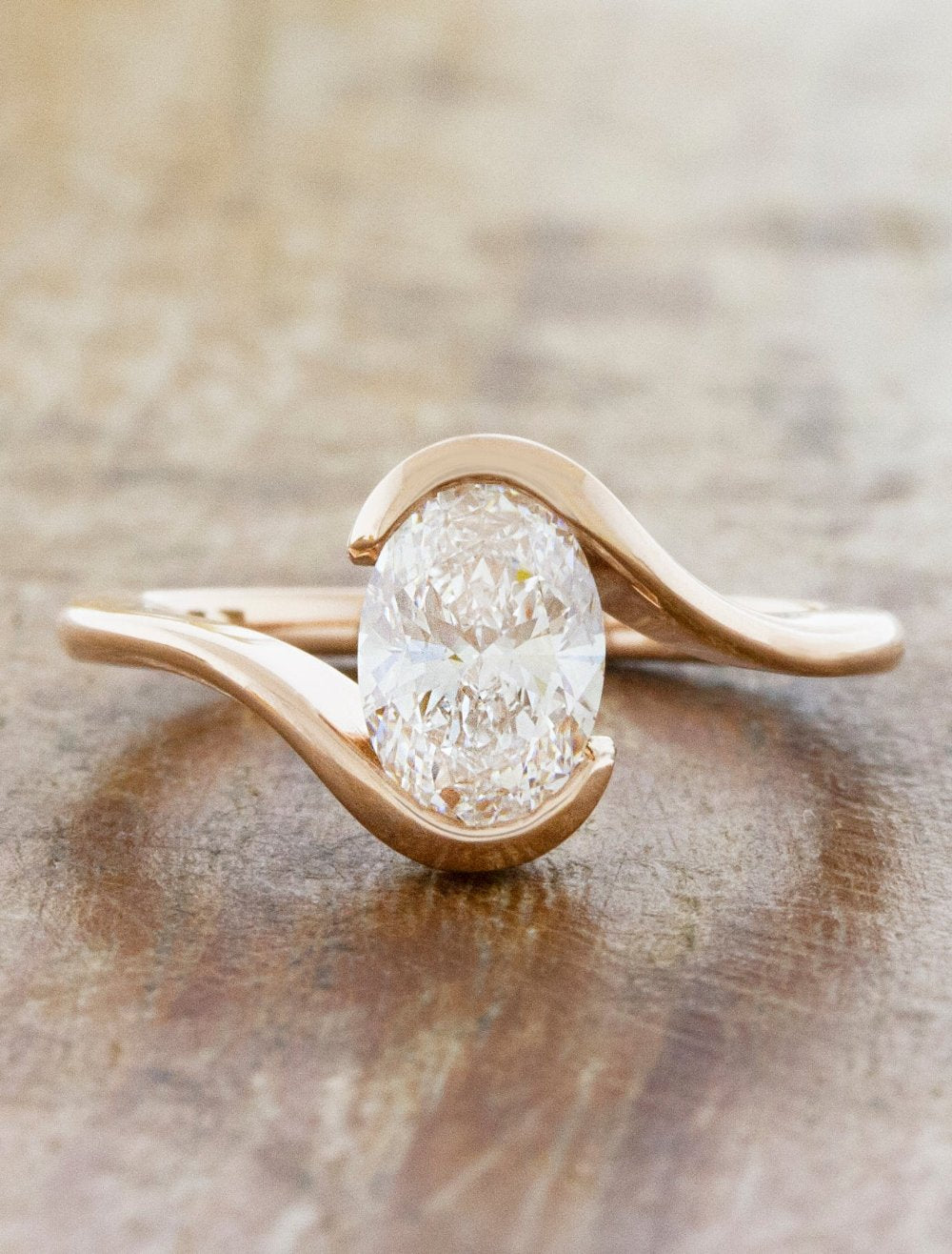 Salomé: Sleek Curved Bypass Bezel Engagement Ring with Oval 