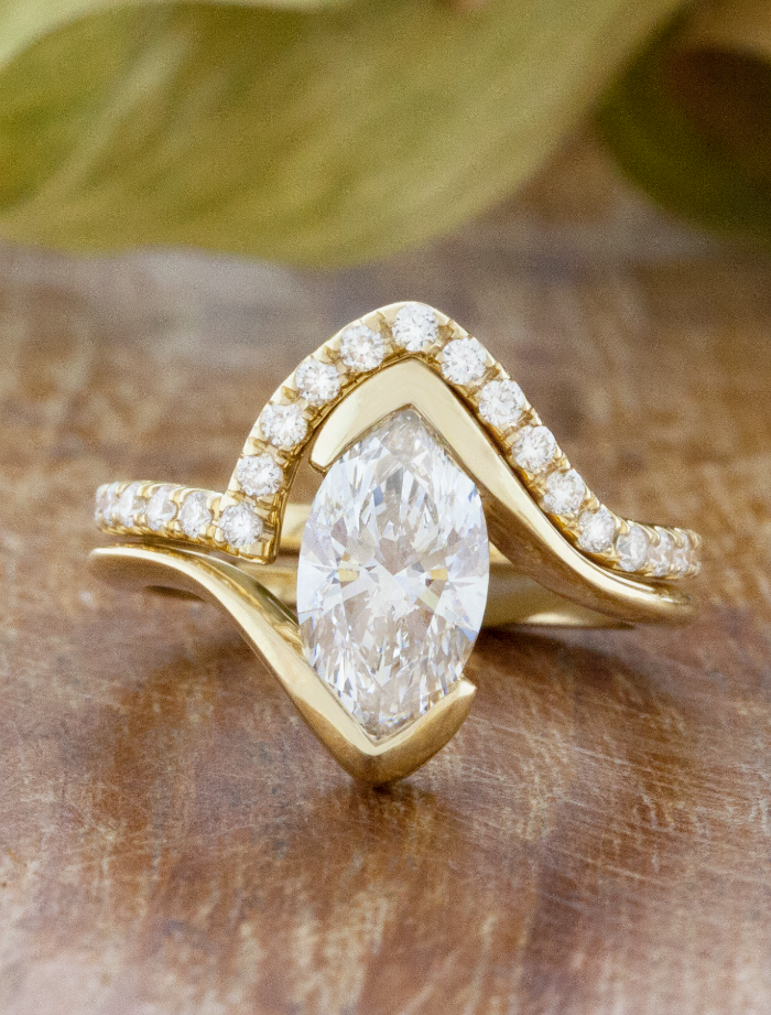 caption:Paired with custom curved Ziggy wedding band in 14k yellow gold