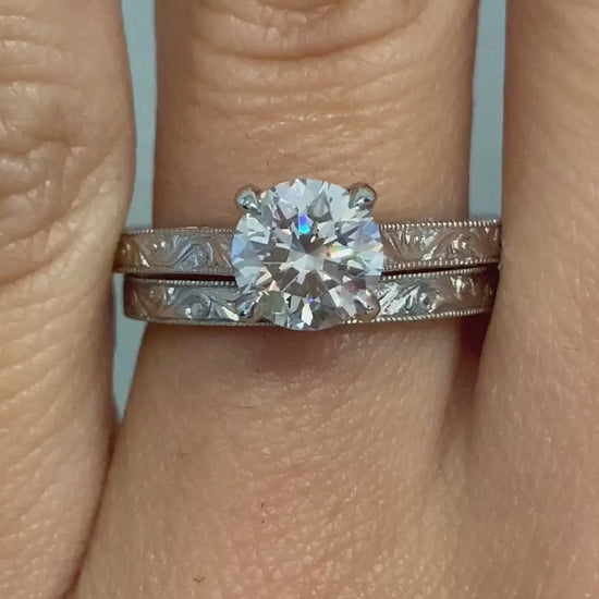 caption:Shown with 1ct round cut diamond paired with Raynee wedding band