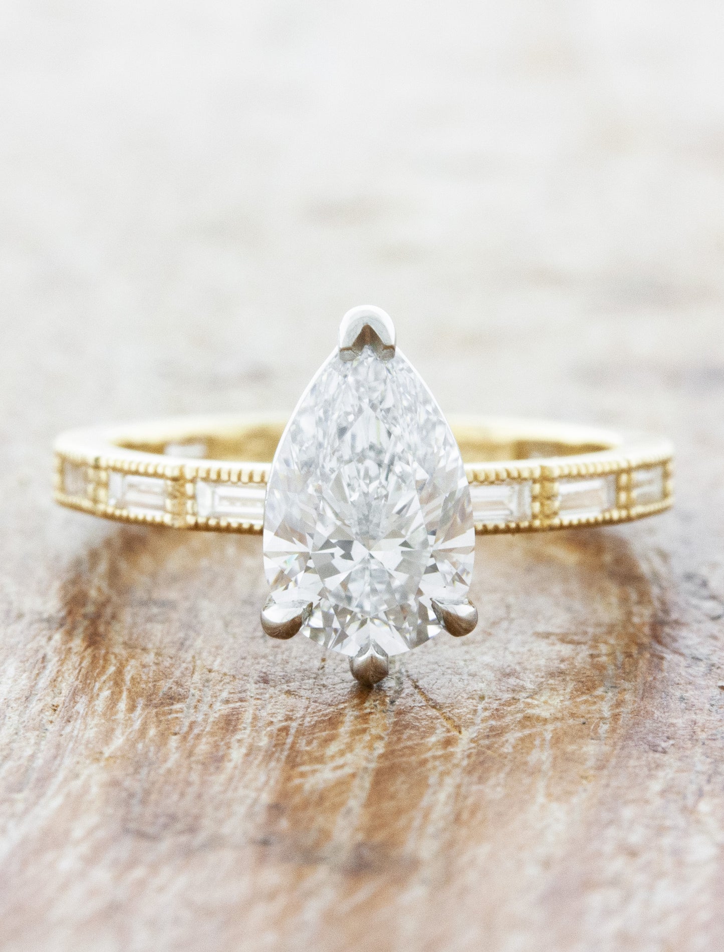 caption:Shown with 1.20ct pear diamond in two toned setting