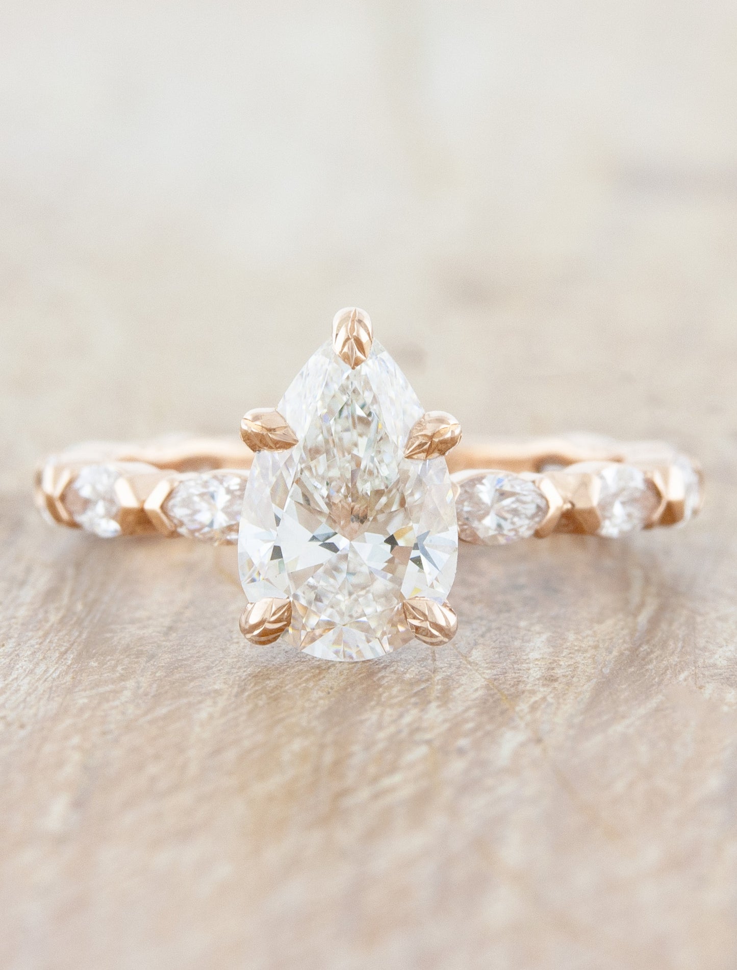 caption:Shown with 1.47ct pear diamond in 14k rose gold