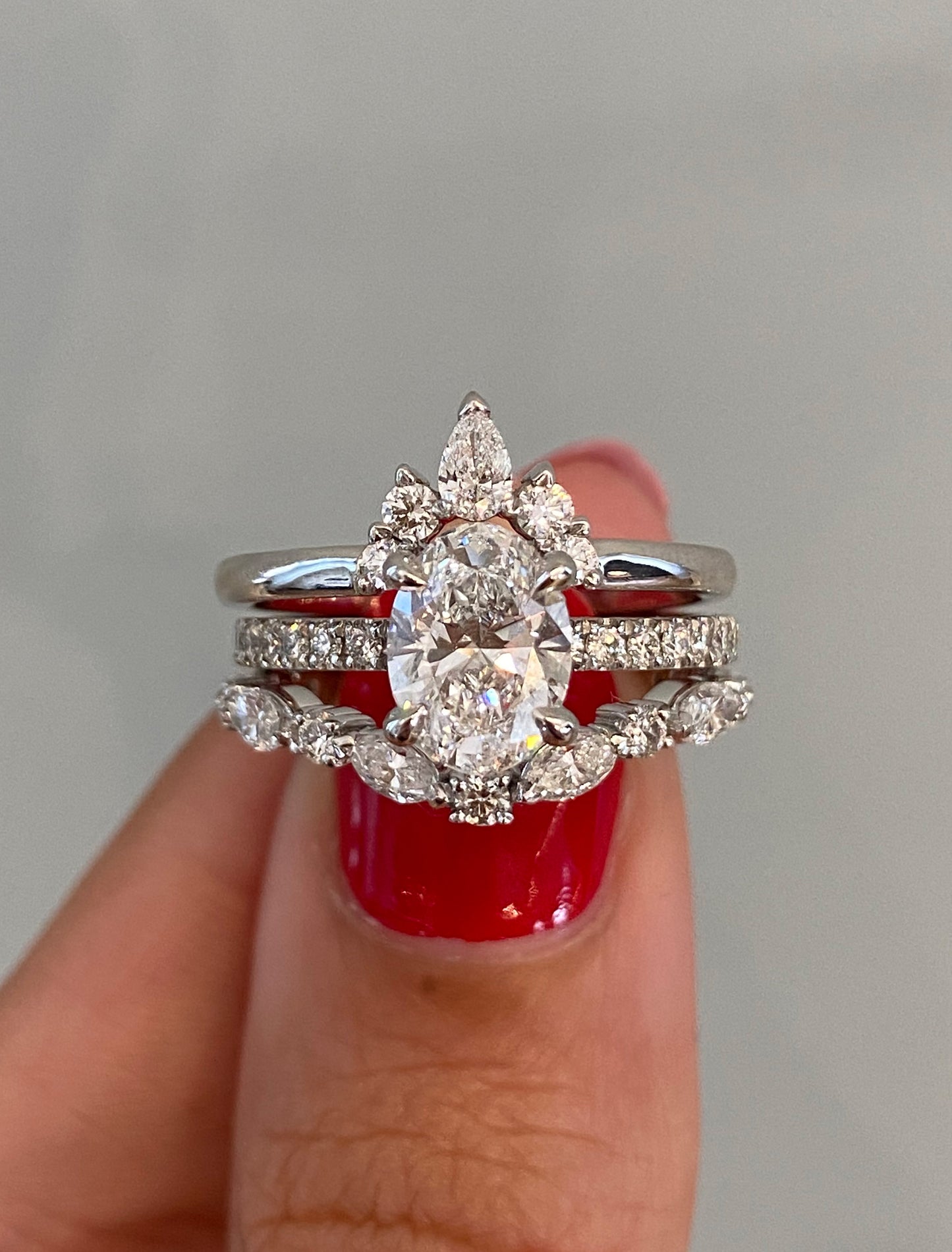 caption:Shown with Laxmie & Marquisa wedding bands in platinum