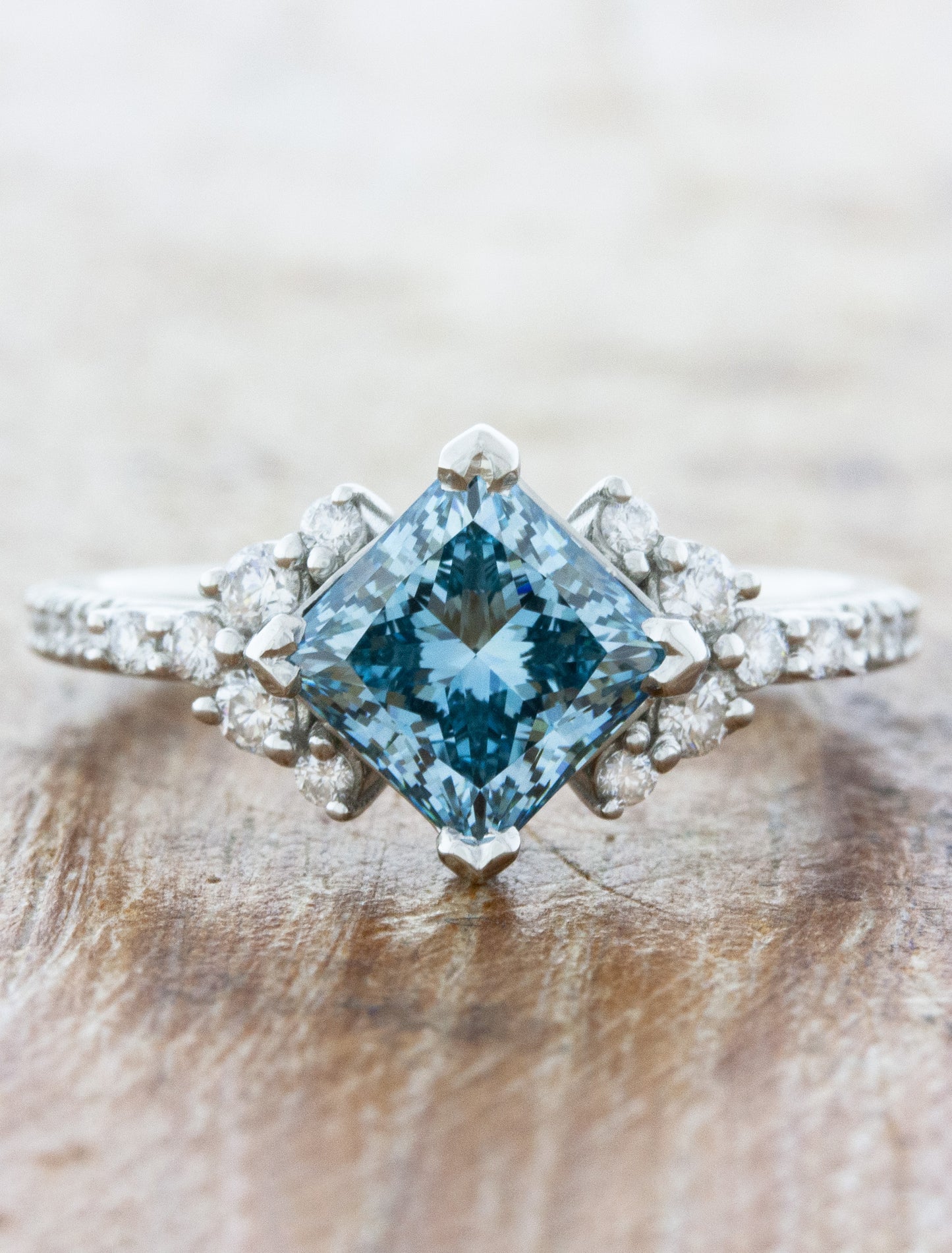 caption:Customized with 1.50ct princess cut fancy blue diamond