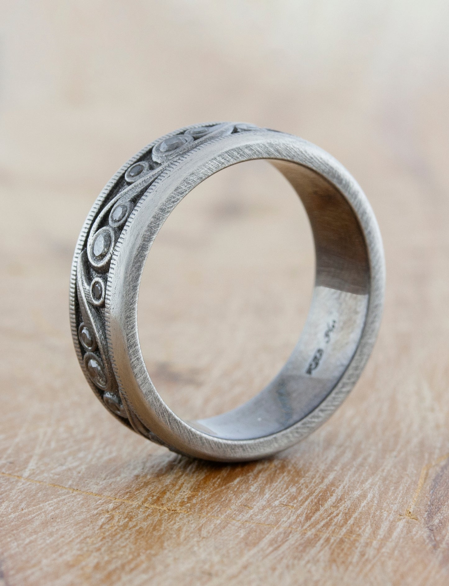 Shown in platinum with black rhodium plating