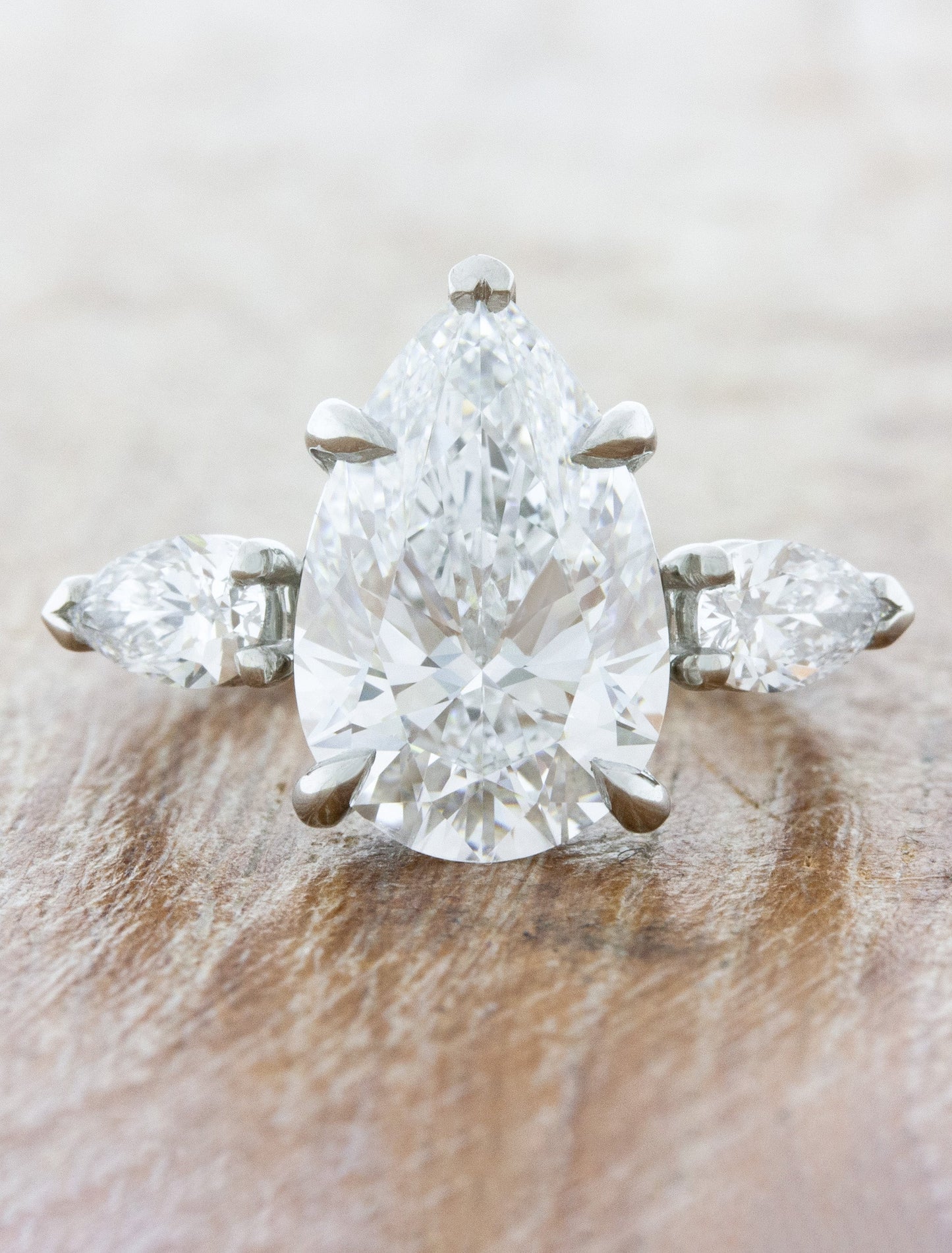 caption:Shown with 3.70ct pear diamond in platinum