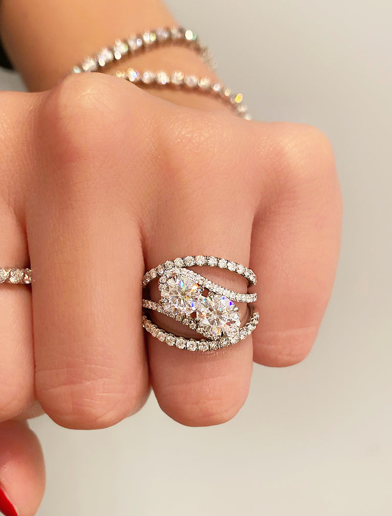 caption:Stacked with Bella wedding bands in platinum