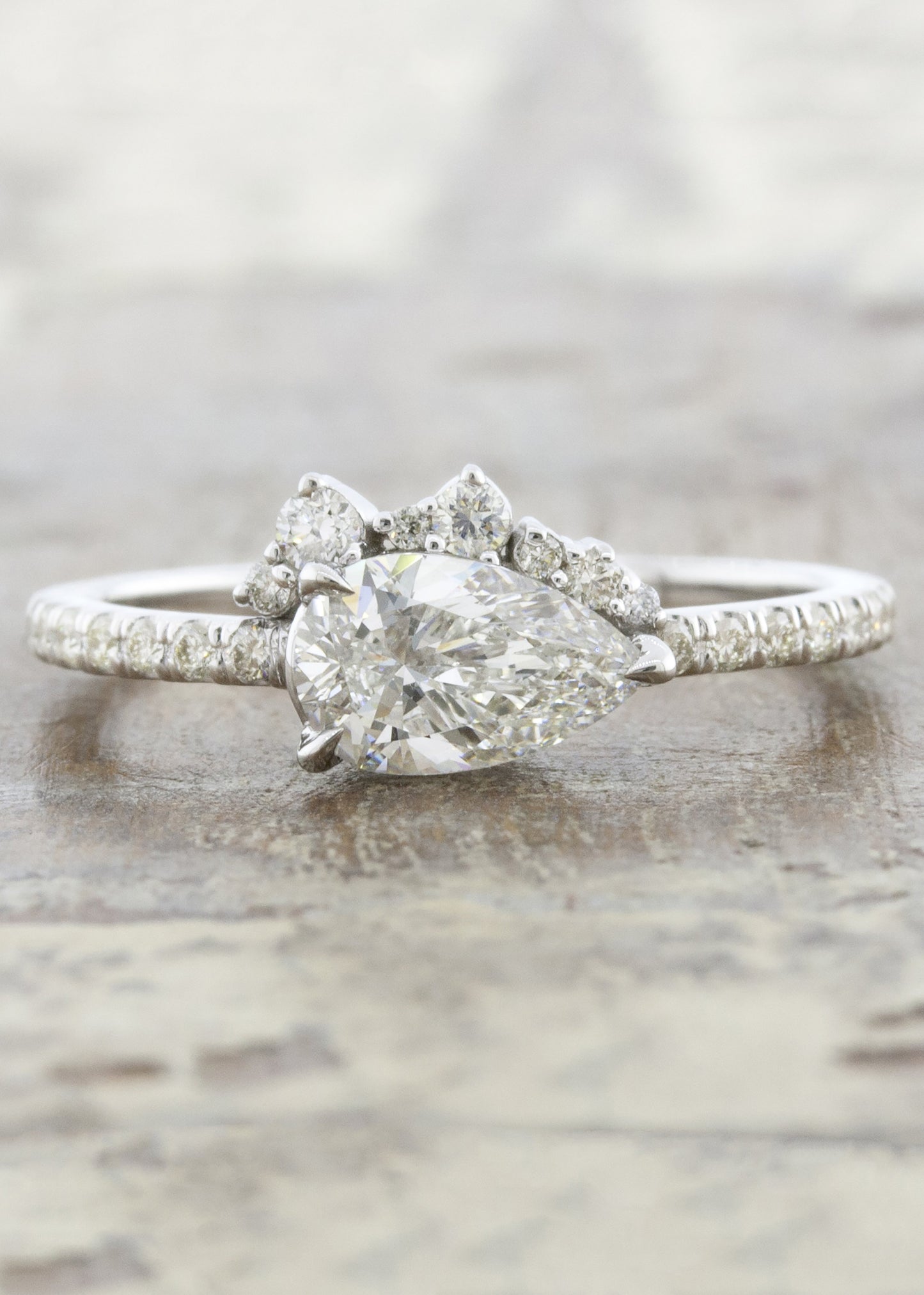 caption:Customized with pear diamond in platinum
