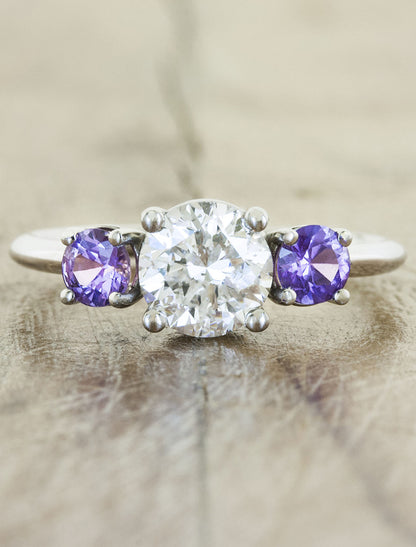 round diamond engagement ring, purple sapphire accents