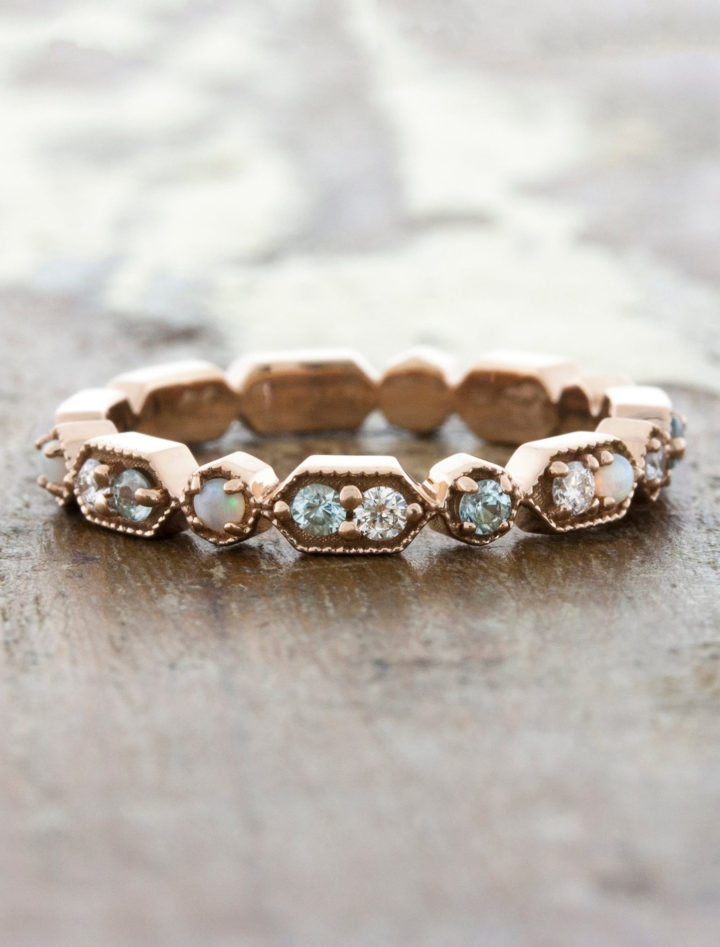 caption:Customized with aquamarines & opals in 14k rose gold