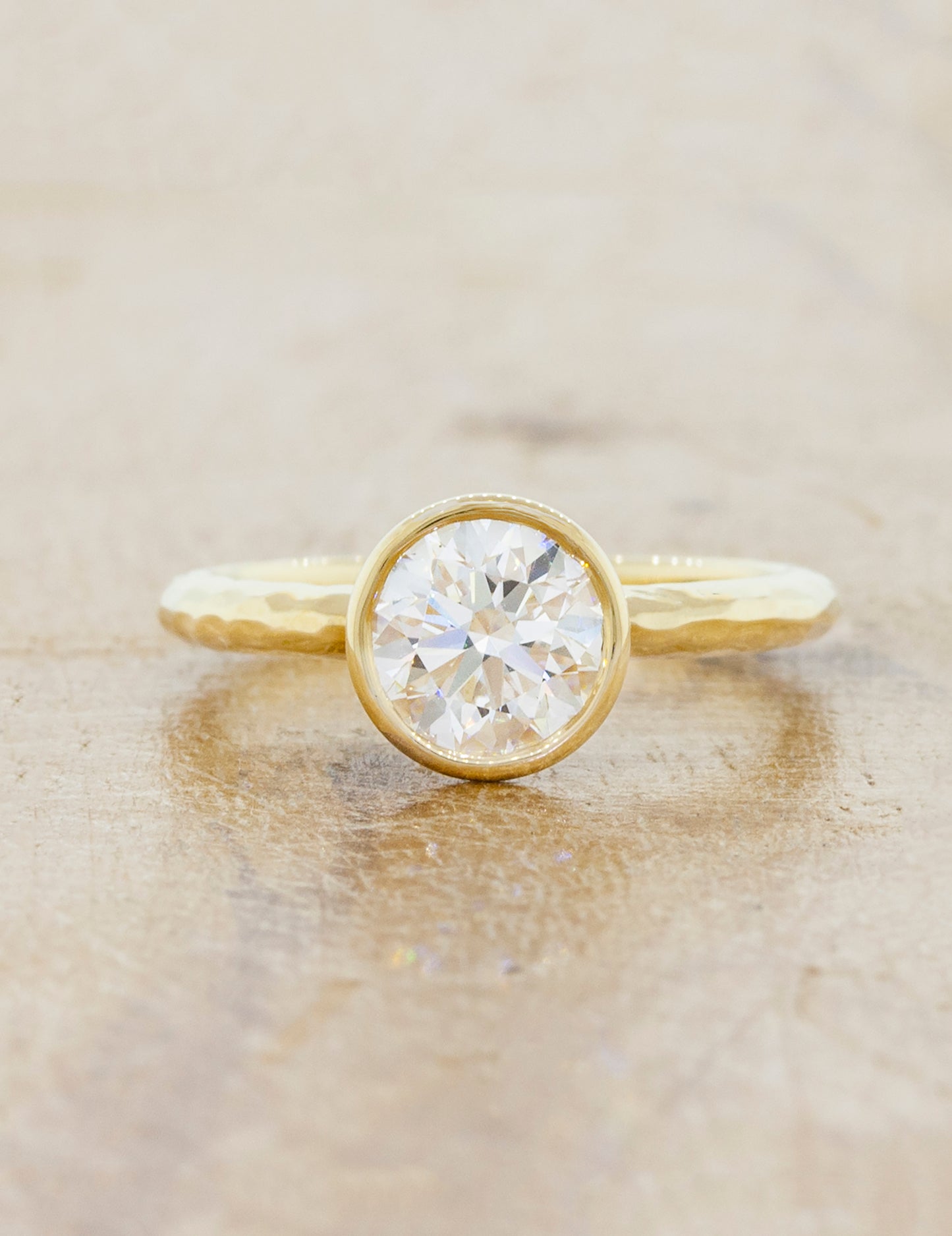 caption:Shown with 1.25ct round with custom hammered texture