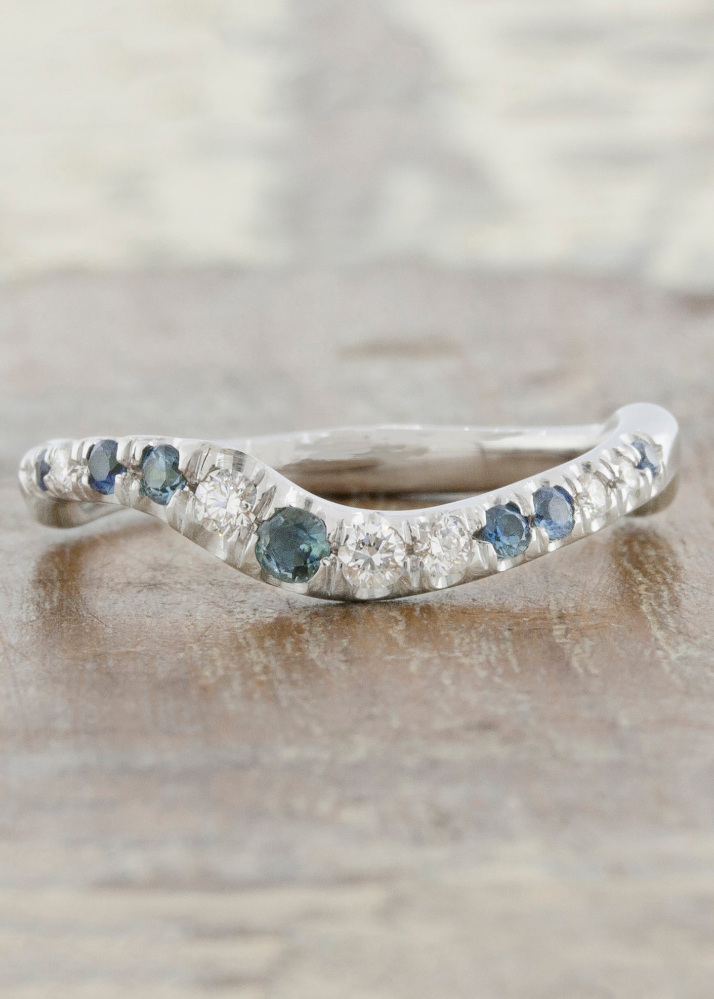 caption:Customized with blue sapphires in platinum