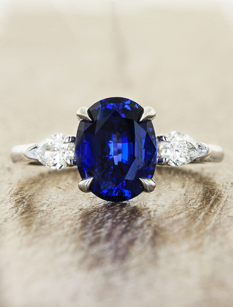 caption:Shown with blue oval sapphire in platinum