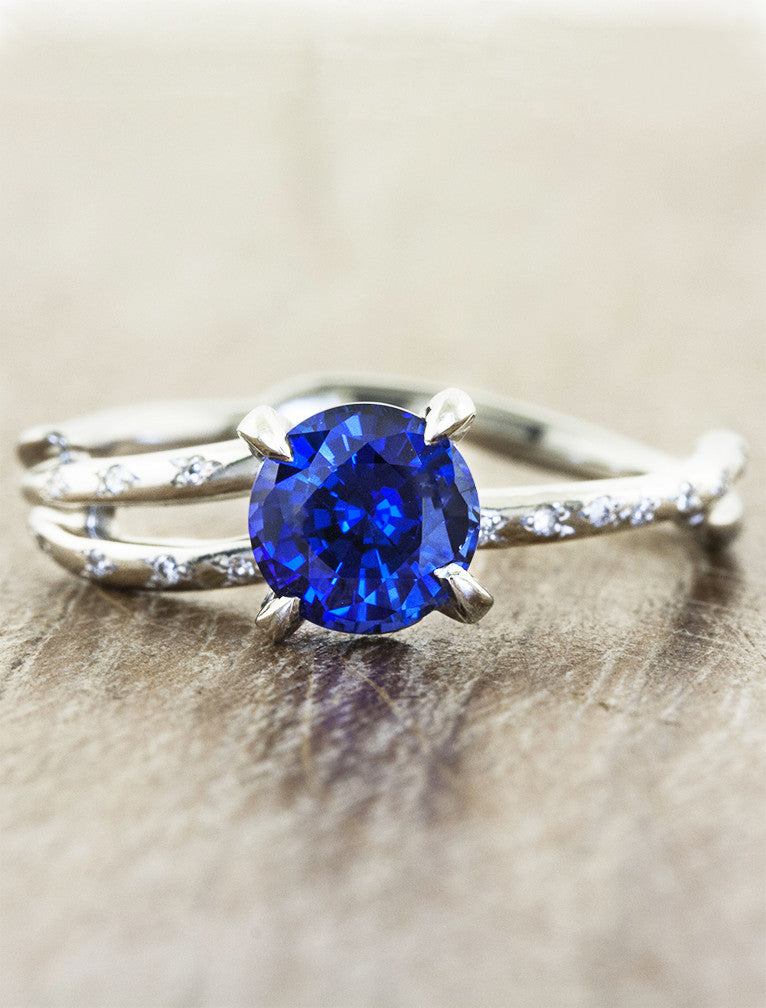 caption:Customized with round blue sapphire in platinum