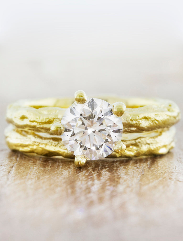 caption:Shown with 1ct round diamond in 18k yellow gold, stacked with Twiggy