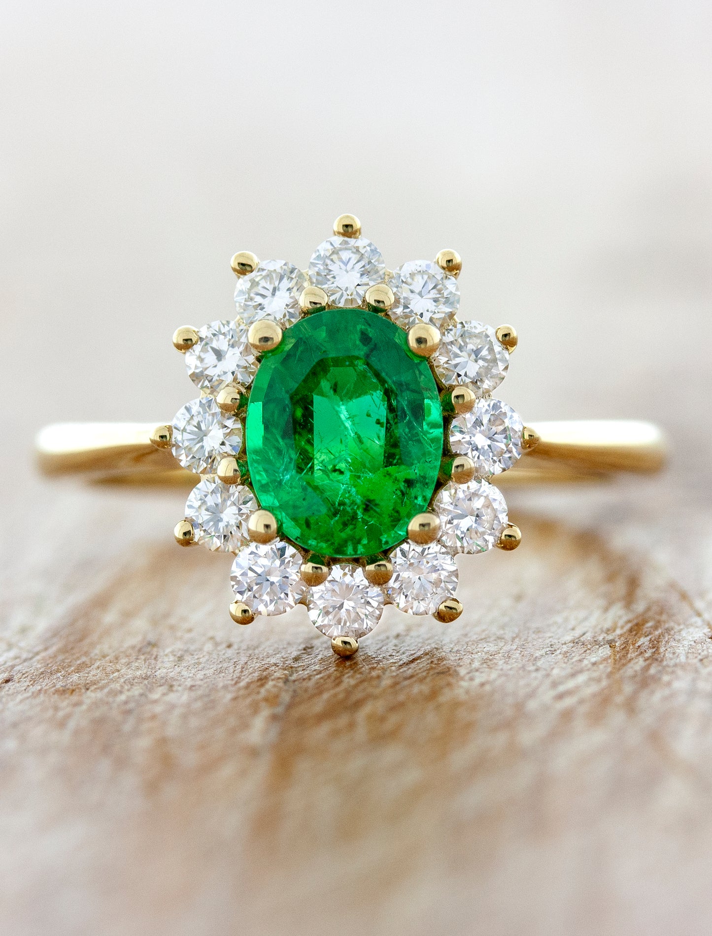 caption:Shown in 14k yellow gold option with green emerald center stone
