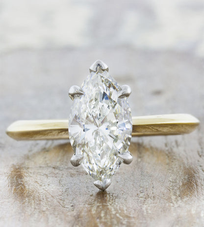 caption:Customized with a marquise shape diamond and two tone setting