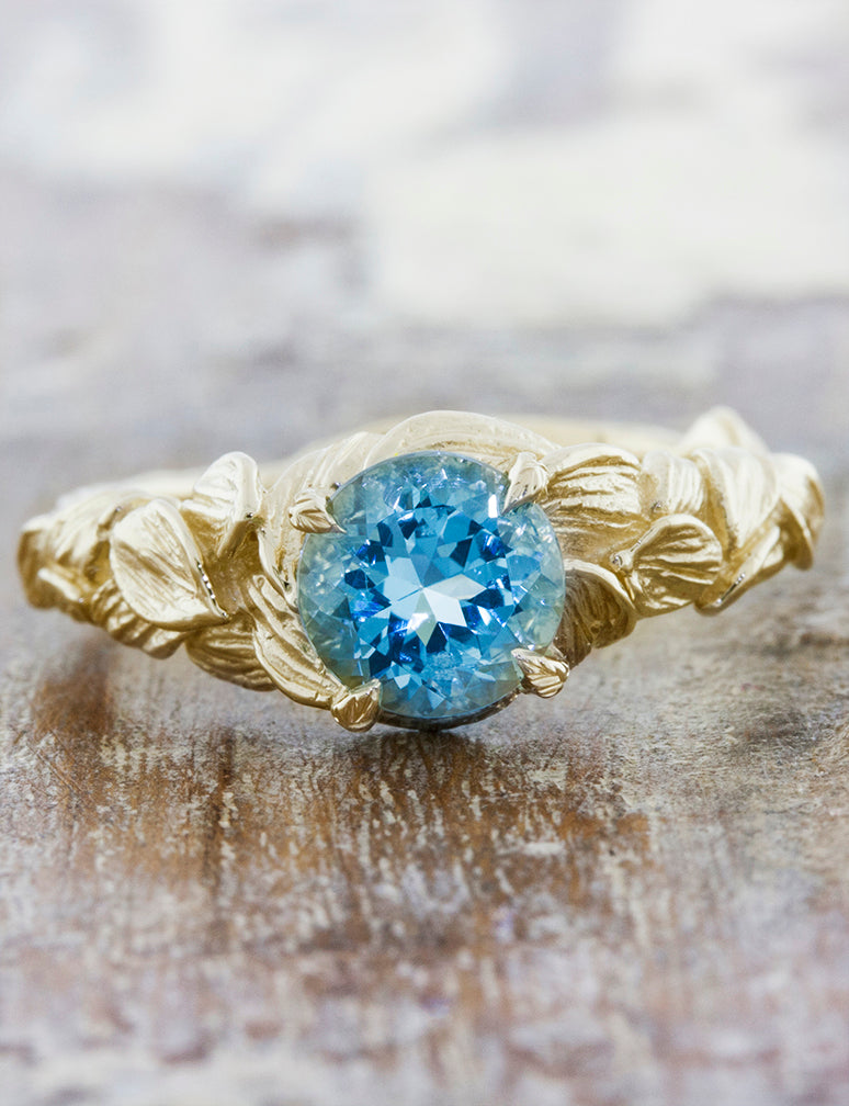 caption:Customized with round aquamarine in yellow gold