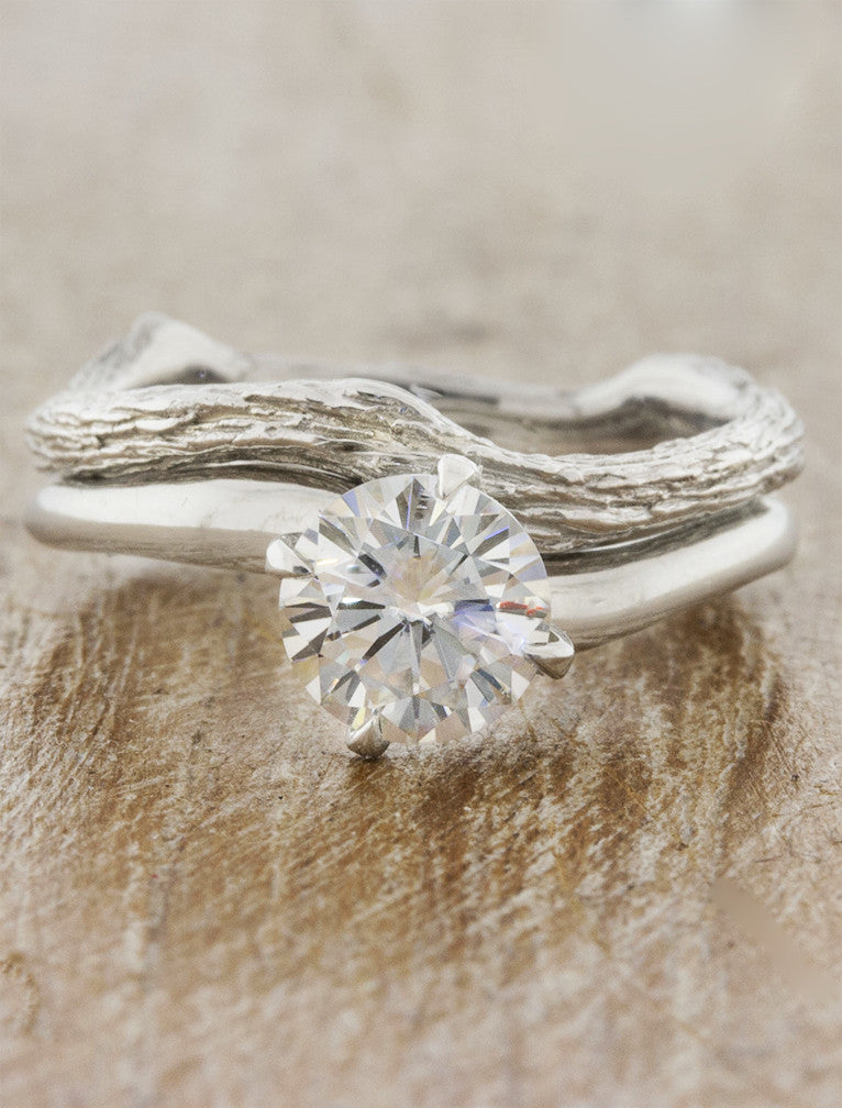 caption:Paired with Aurora engagement ring in platinum