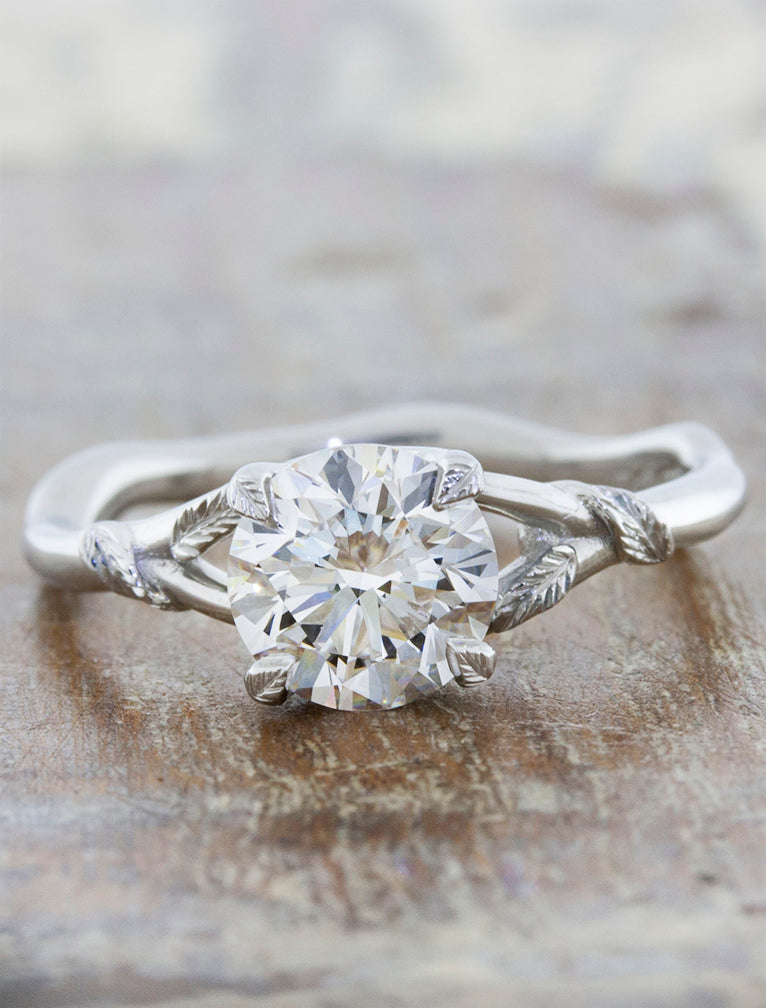 caption:Shown with 1.25ct round diamond in platinum