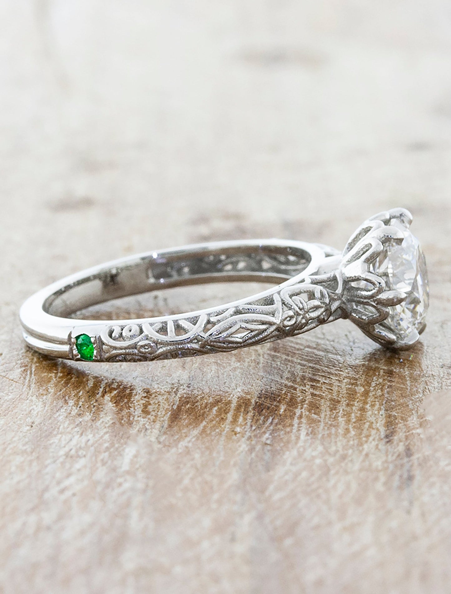 caption:Customized with emerald accent stone