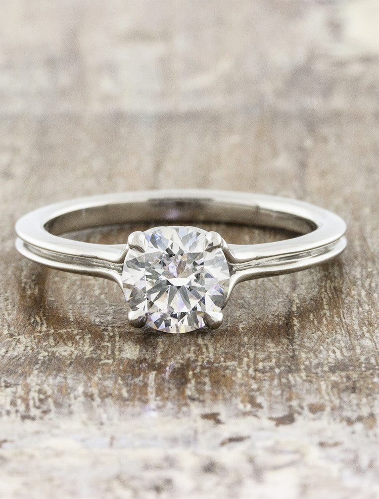 caption:Shown with 0.90ct round diamond in platinum