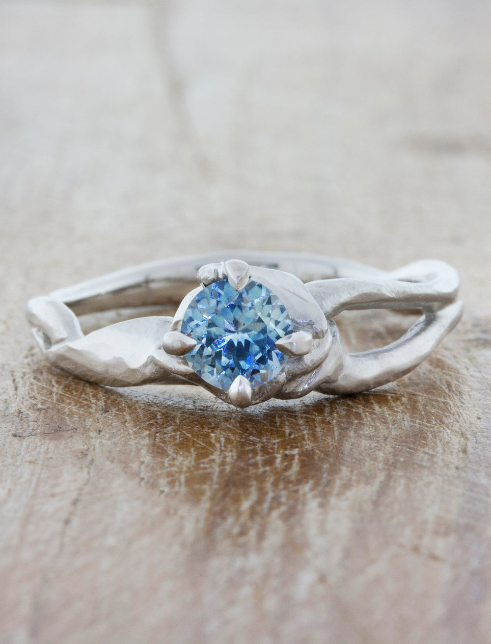 caption:Customized with round blue sapphire in platinum