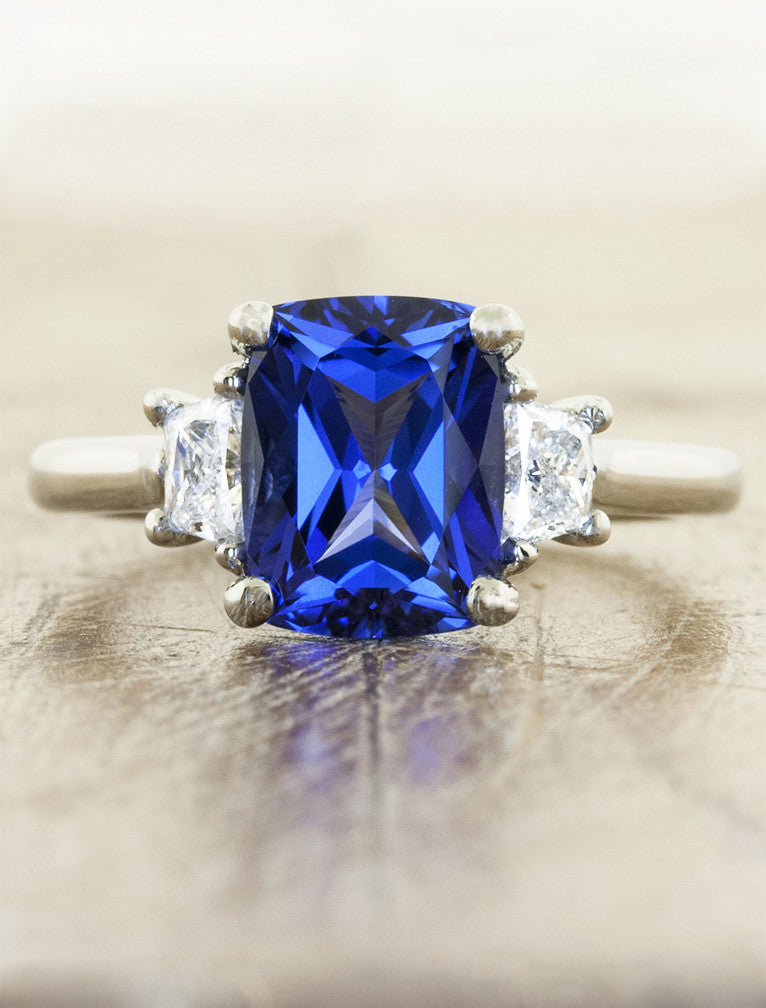 Cushion cut sapphire 3 stone engagement ring with side trapezoids