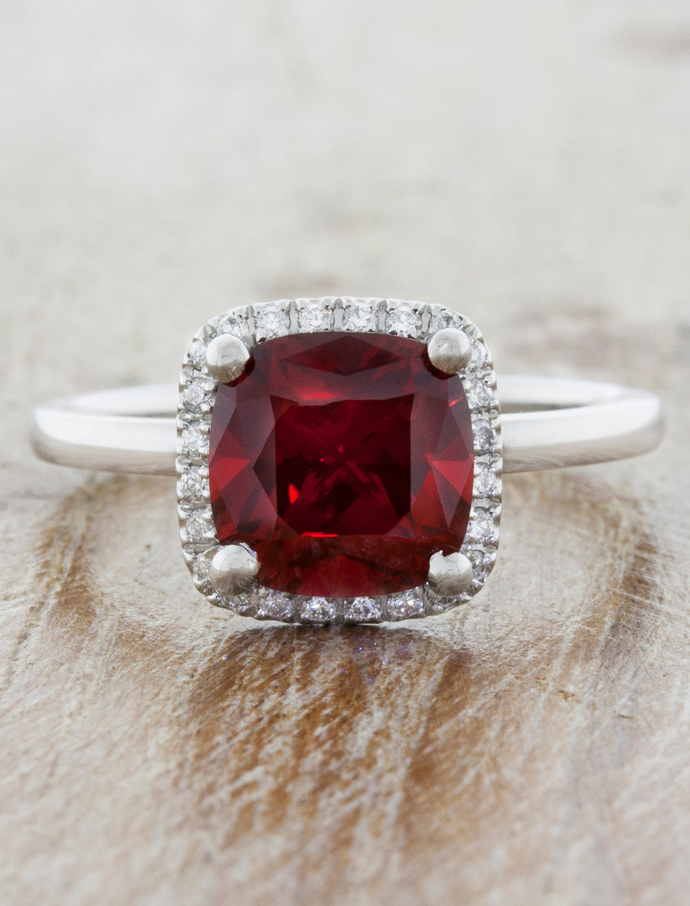 caption:Shown with cushion cut ruby in platinum