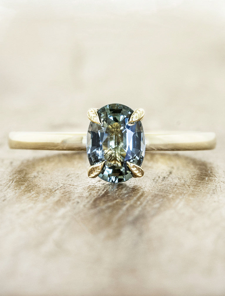 caption:Customized with oval aquamarine & leaf prongs in 14k yellow gold