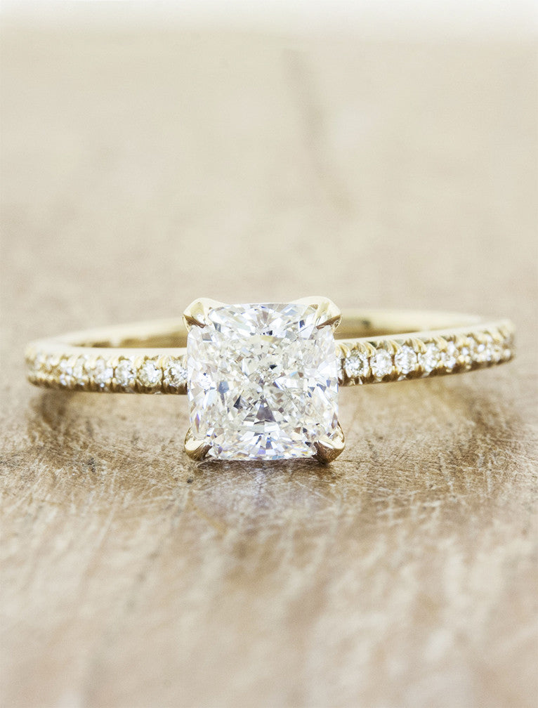 caption:Shown with 1ct. cushion cut diamond in 14k yellow gold