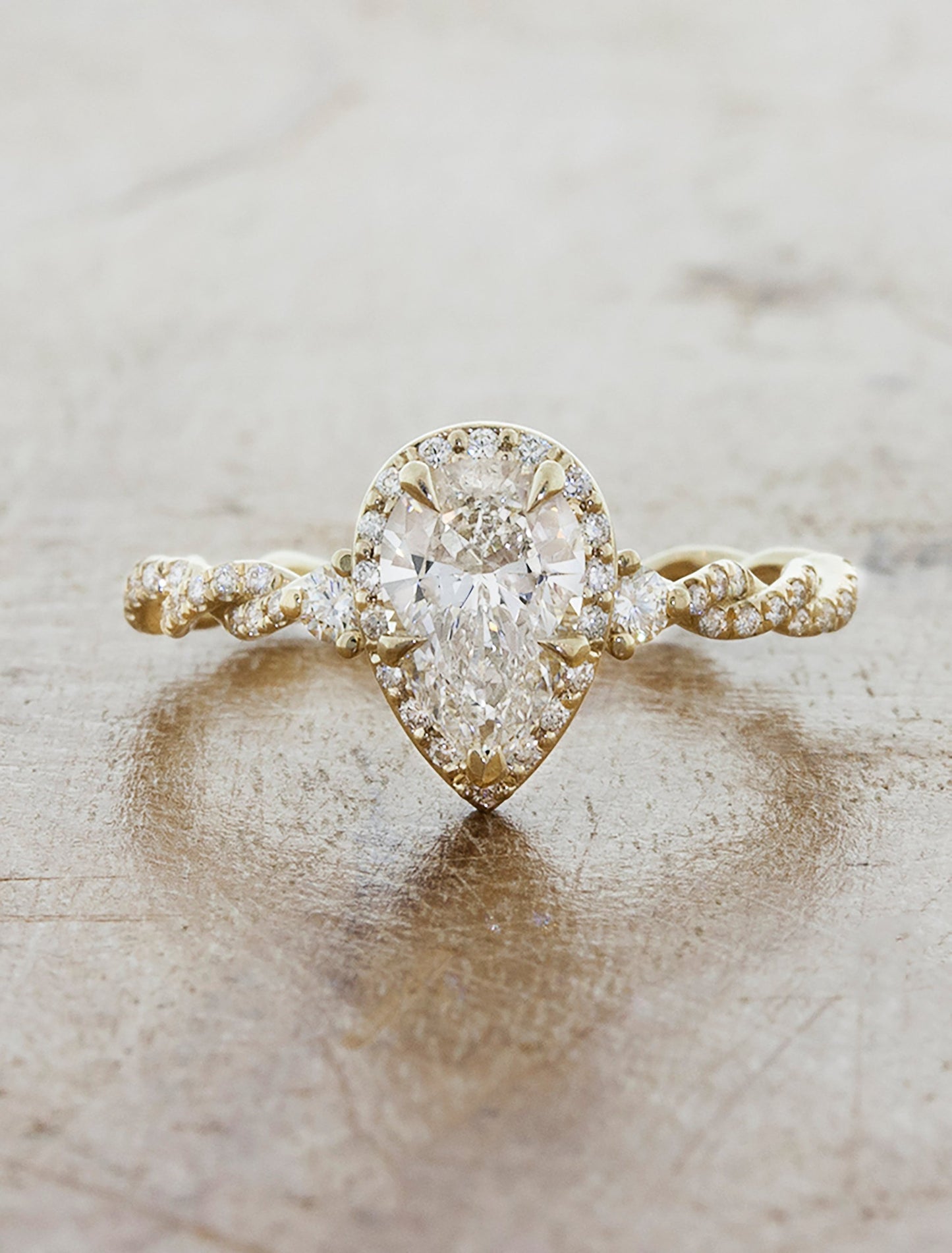 caption:Shown with 1.00ct pear diamond in 14k yellow gold
