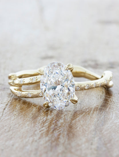 Nature inspired engagement ring leaf prongs. caption:Customized with an 1.25ct. Oval Diamond 14k Yellow Gold