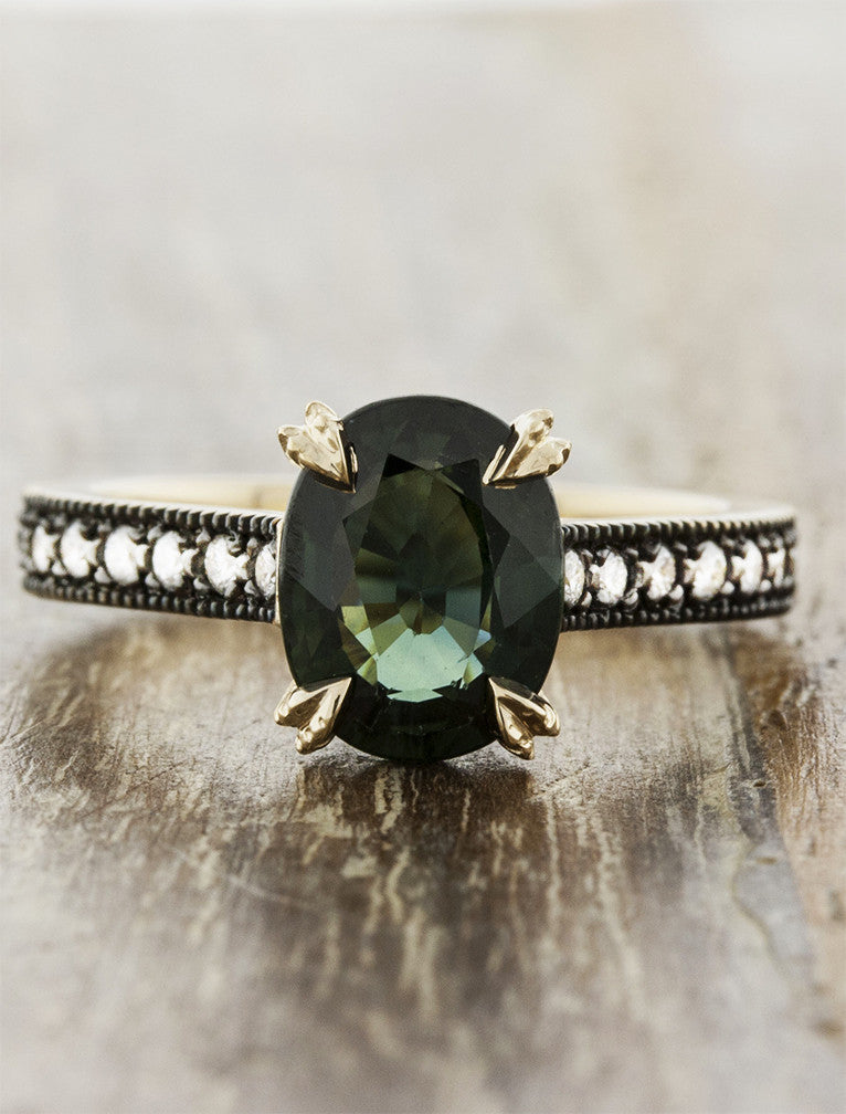 caption:Shown with dark green oval sapphire in 14k yellow gold