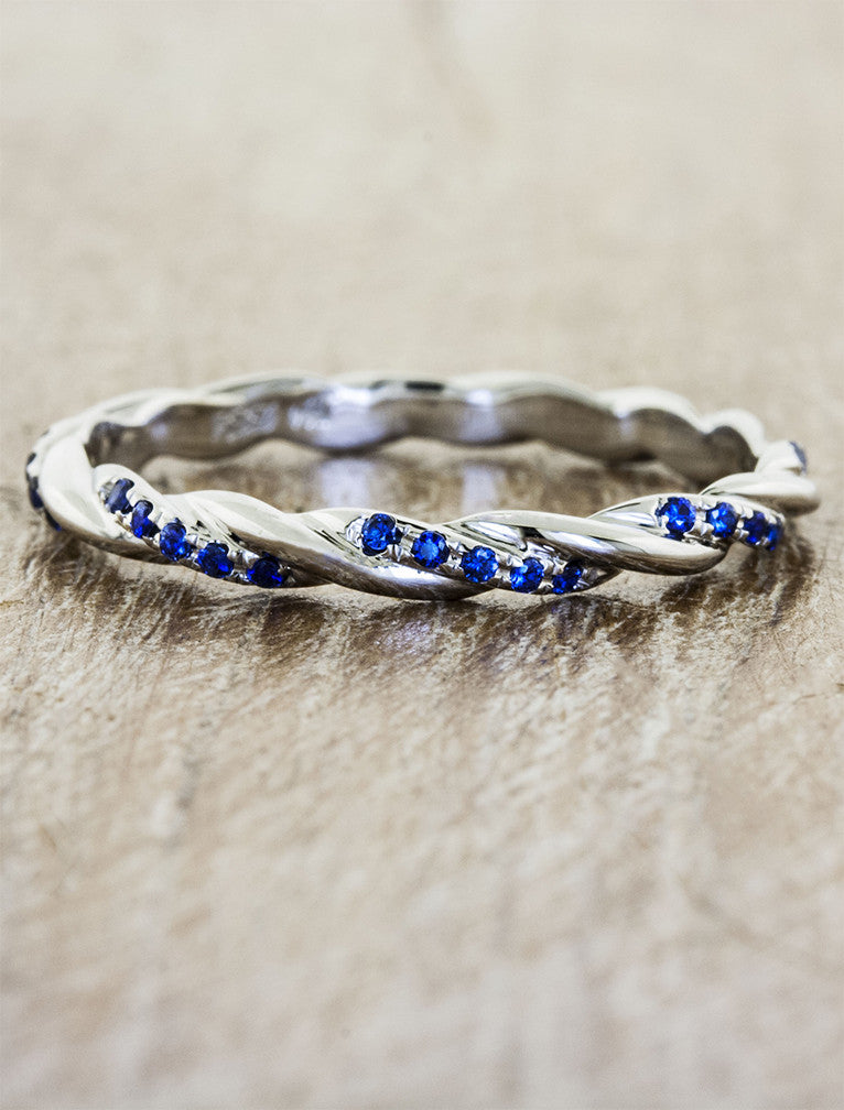 caption:Customized with blue sapphires in platinum