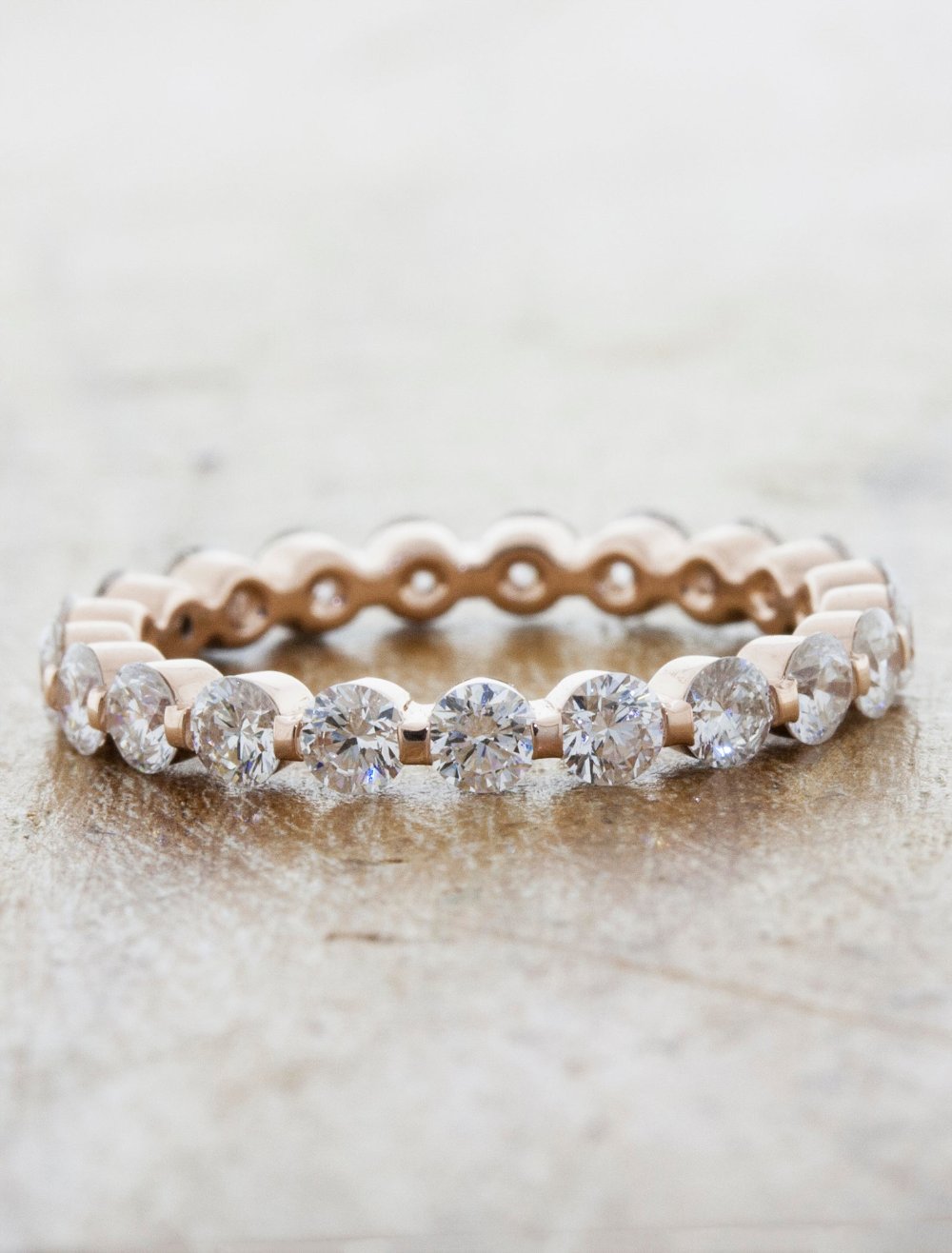 caption:Shown in custom eternity setting in 14k rose gold
