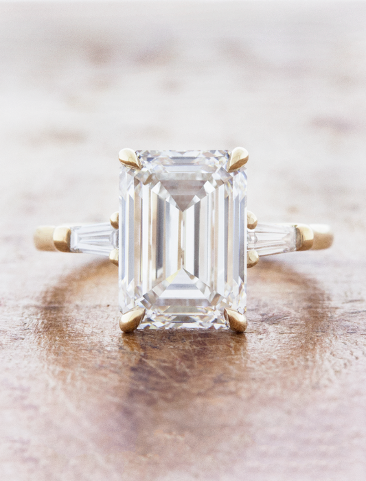 caption:Shown with 4.5ct emerald cut diamond in 14k yellow gold