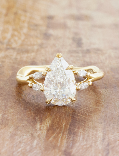 caption:Shown with 2ct pear in 14k yellow gold 