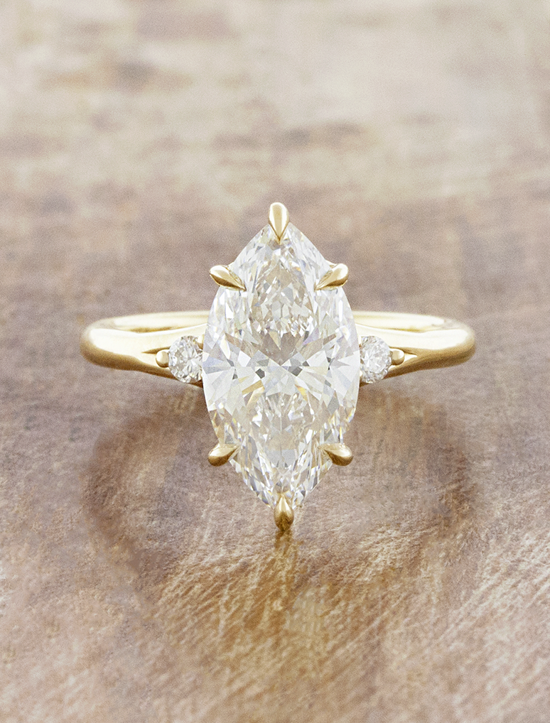 caption:Shown with 3ct marquise in 14k yellow gold