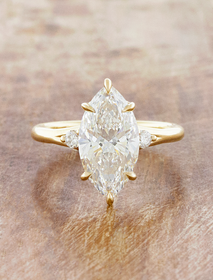caption:Shown with 3ct marquise in 14k yellow gold