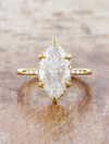 caption:Shown with 3ct marquise diamond in 14k yellow gold