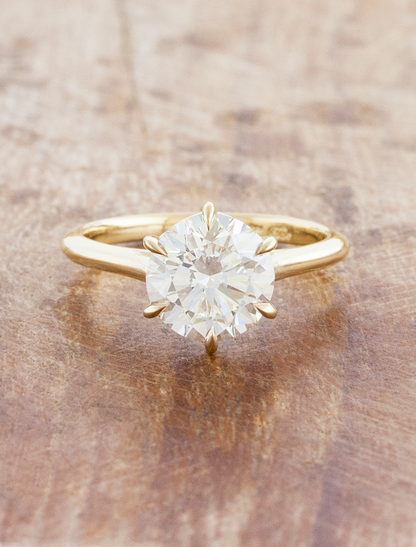 caption:Shown with 3ct round in 14k yellow gold