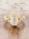caption:Shown with 3ct emerald cut in 14k yellow gold 