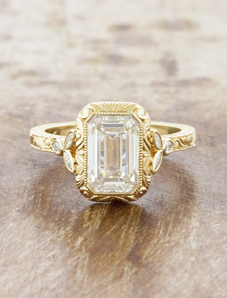 caption:Shown with 3ct emerald cut in 14k yellow gold 