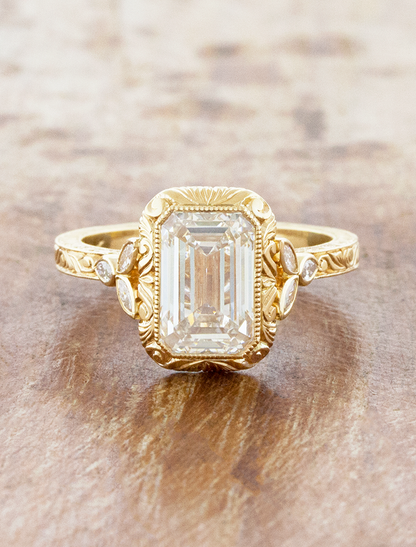 caption:Shown with 3ct emerald cut in 14k yellow gold 