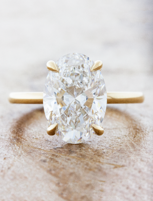 caption:Shown with 4ct oval in 14k yellow gold