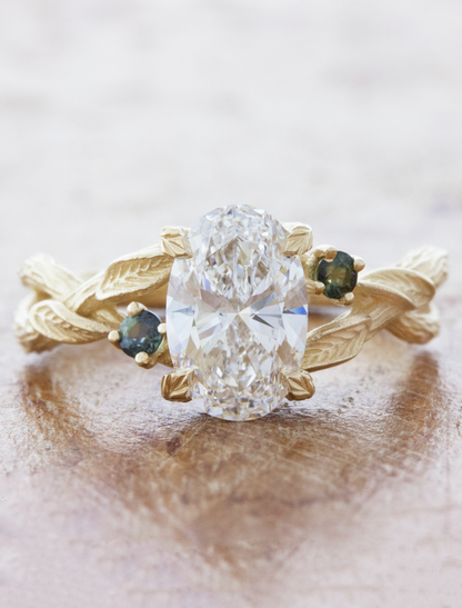 caption:1.53ct oval diamond w/ blue green sapphires